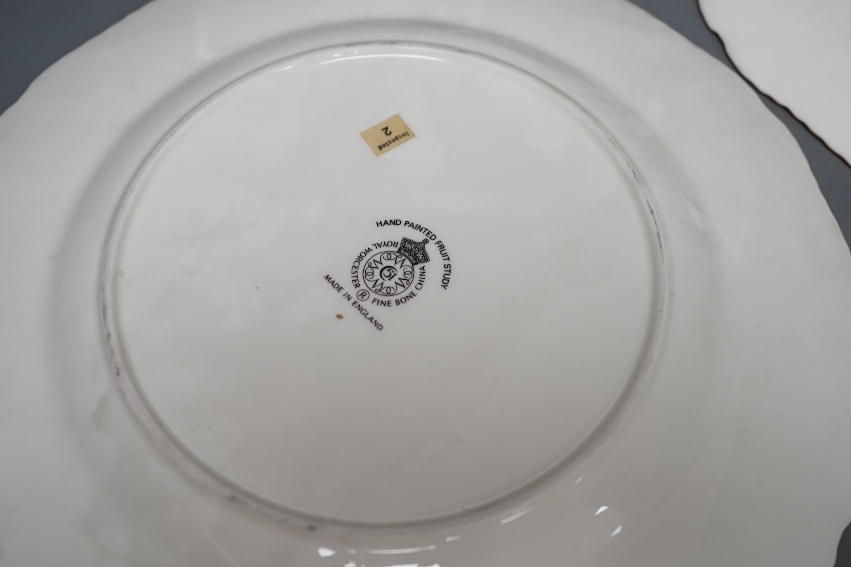 A pair of Royal Worcester fruit painted dinner plates, post war, by J. Reed, 27cm diameter